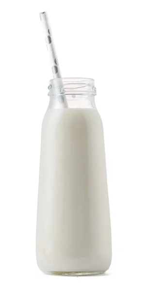 Copa de vidrio de leche con una paja aislada en blanco —  Fotos de Stock