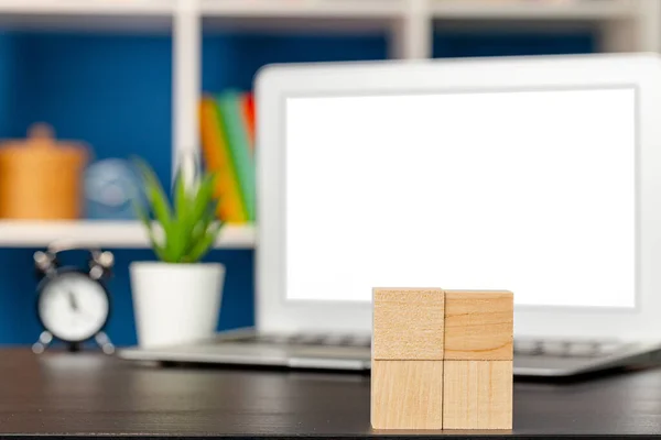 Blank wooden cubes with copy space for your design on office working table