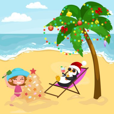Karikatür penguen ile plajda kumda oynayan kız bebek