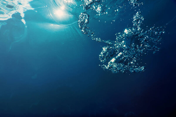 Underwater bubbles with sunlight. Underwater background bubbles.