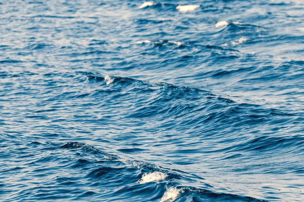 Waves behind a boat, Patterns of waves in water.