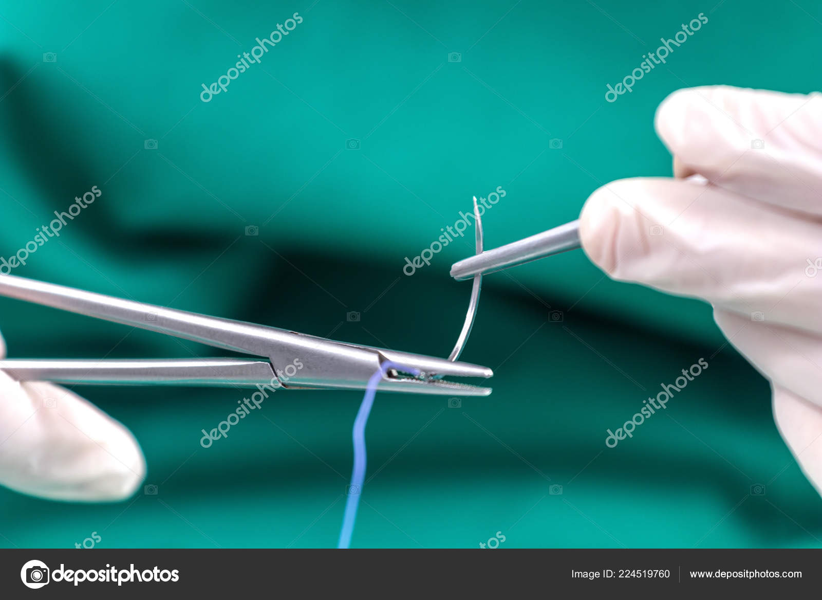 Doctor Holding Surgical Forceps Suture Needle Suturing Material Stock Photo by ©Allexxandar