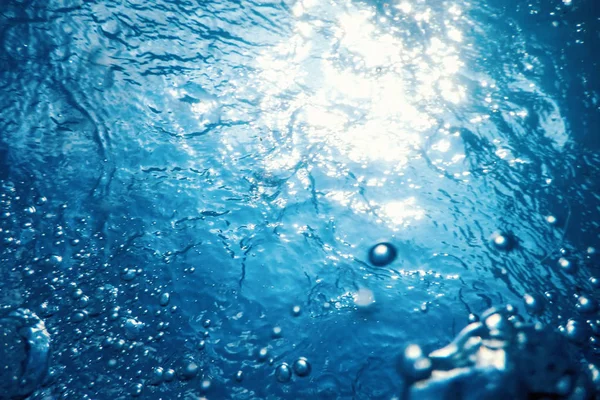 Underwater bubbles with sunlight. Underwater background bubbles.