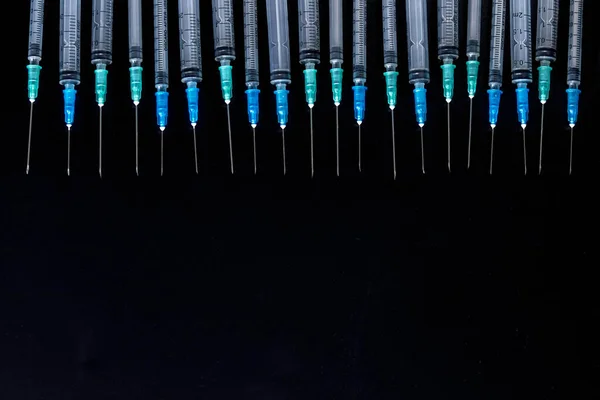 Medical Syringes with Needle on Black Background, Close up Syringe, Health care concept.