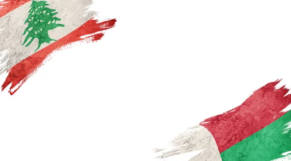 Flaggen Des Libanon Und Madagaskars Auf Weißem Hintergrund — Stockfoto