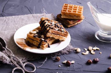 Viennese waffles with chocolate and cream topping clipart