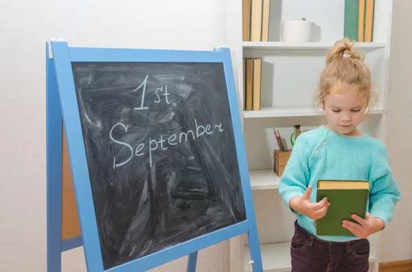 Girl Child Chalk Board Inscription September Book His Hands — Stock Photo, Image