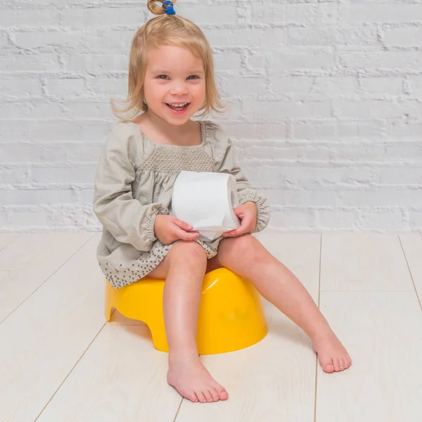 Girl Dress Child Sitting Yellow Pot Toilet Paper His Hands — Stock Photo, Image