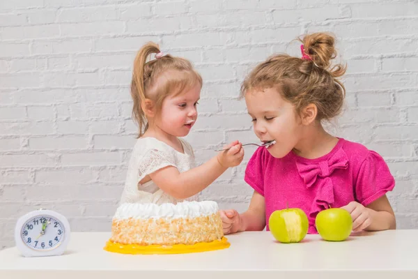 healthy eating and obesity, girls, kids eating cake and apples,