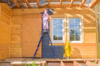 çocuk bir ev fırçadışarı boyar