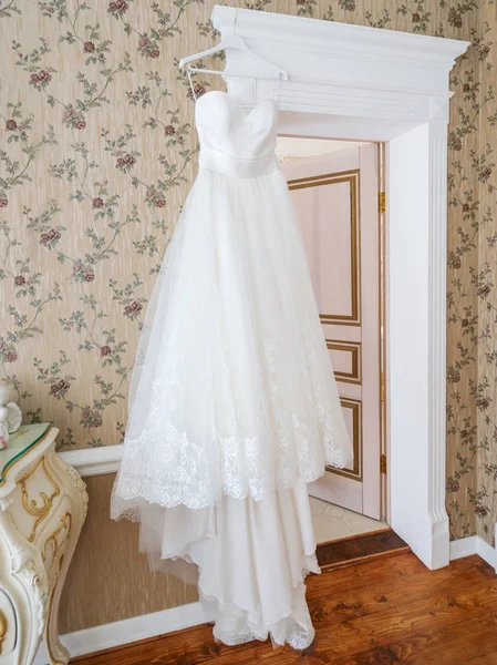 Bridal white dress in room with retro design.