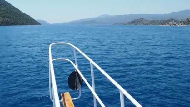 Touristic yacht goes to famous Kekova island. Bow of yacht over sea waves. Ship passed many different little islands. Turkey. — Stock Video