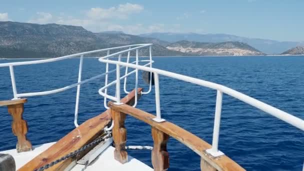 Touristic yacht goes to famous Kekova island. Bow of yacht over sea waves. Ship passed many different little islands. Turkey. — Stock Video