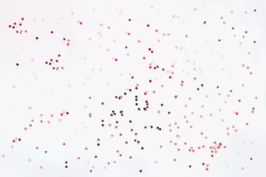 Gümüş ve pembe yıldız konfeti ile tatil arka plan. Noel ve yeni yıl kartları için iyi bir arka plan.