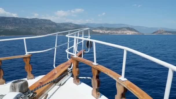 Touristic yacht goes to famous Kekova island. Bow of yacht over sea waves. Ship passed many different little islands. Turkey. — Stock Video