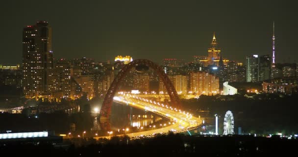 Night panorama view of Moscow, Russia. Architectural landmarks - Jivopisniy bridge, Stalin skyscraper, Ostankino Tower. — Stock Video