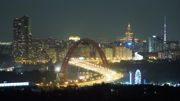 Night panorama view of Moscow, Russia. Architectural landmarks - Jivopisniy bridge, Stalin skyscraper, Ostankino Tower. — Stock Video
