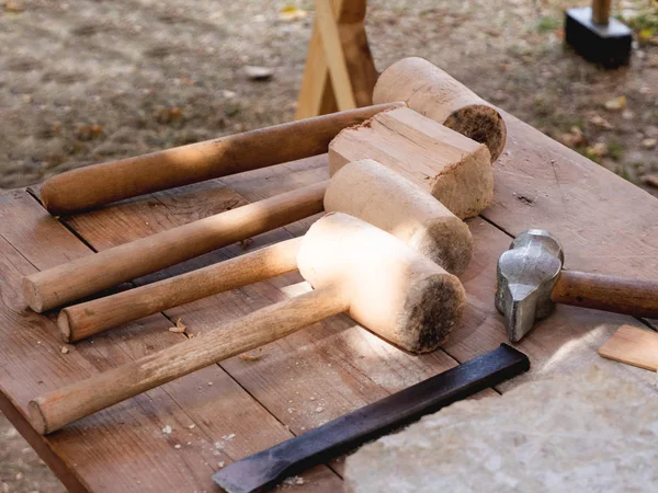 Medieval builder tools, wooden hammers . Annual festival Times and Epochs. Historical reconstruction. Moscow, Russia.