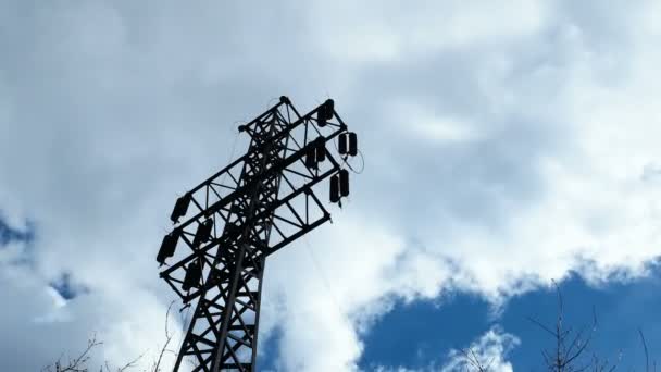 Timelapse clip of clouds moving over power line column. Cloudscape on blue sky. — Stock Video
