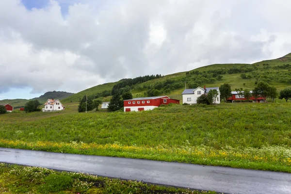 Beautiful scandinavian landscape with meadows, mountains and village. Lofoten islands, Norway. Stock Picture