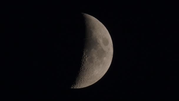 Natural night background with dark sky and half Moon, Earth satellite. Waxing gibbous phase. — Stock Video