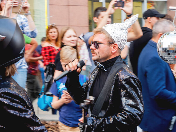 MOSCOW, RUSSIA - September 07, 2019. Procession of street theater actors and musicians in costumes of robots down Tverskaya street. Street festival and different leisure activities on Moscow Day celebration.