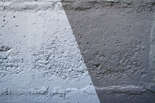 Colorful (light and dark grey) painted wall as background or texture