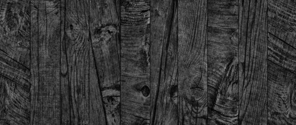 黒古い風化腐ったひびの入った結び目大まかなパインウッド床板グランジ表面テクスチャの詳細 — ストック写真