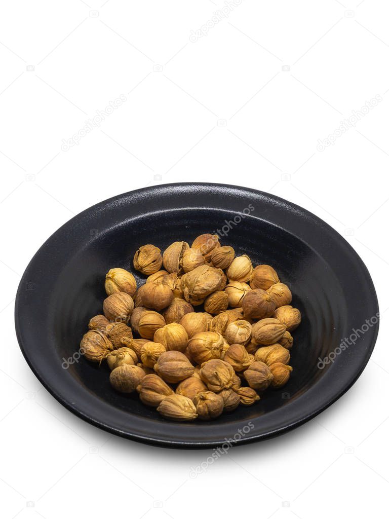 Dried Herbs,Amomum krervanh Pierre,Siam Cardamom , Put in a cup , isolated on white background. (clipping path