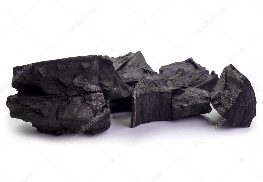 Natural black coals isolated on white background. (Industrial coals)