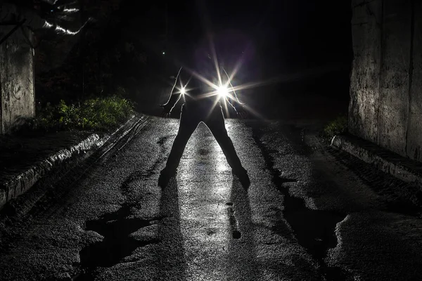 silhouette of man standing alone. night scene.