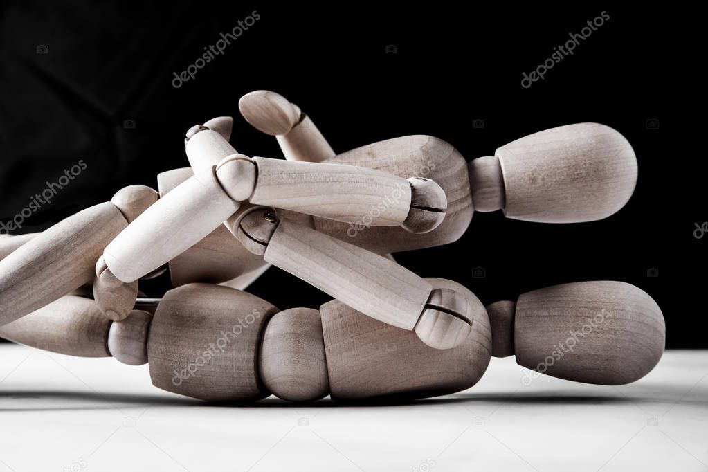 two wooden mannequins. night scene 