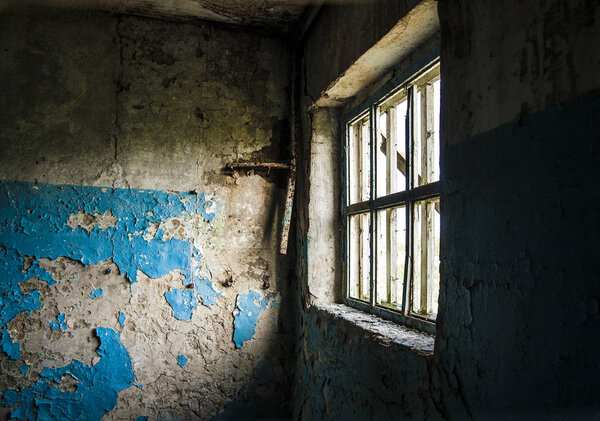Large glass window inside industrial interior angle shot. day light scene through the window from dark room. angle inside dark room.