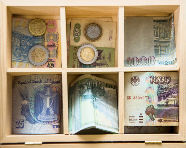banknotes and  coins. Concept: money or shopping. wooden cashbox.