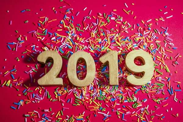 2019 happy New Year card.  number 2019 against red paper background.