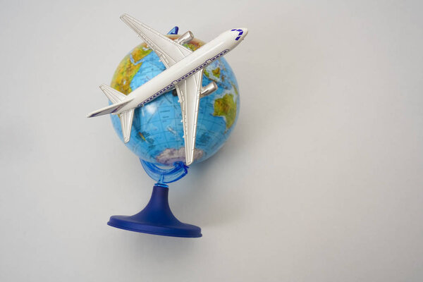 plane on the globe  - round the world air travel