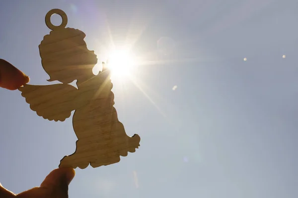 Male Hand Holding Wooden Figure Angel Sunset Sky — Stock Photo, Image