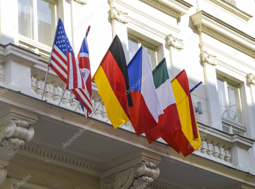 Flags of European and North American countries hanging off  balcony. Prague, Czech Republic