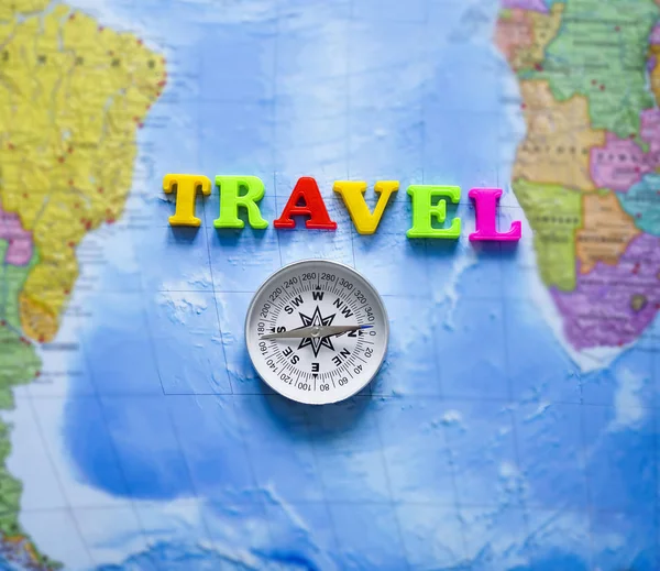 Metal Compass Word Travel Made Colorful Letters World Blue Map — Stock Photo, Image