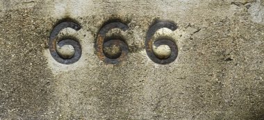 number 666 on stone background. iron number clipart
