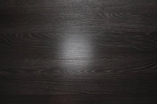 Rough black wood background. gradient light on texture.