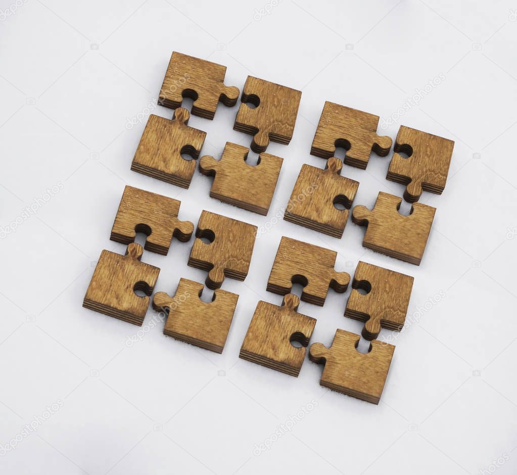 wooden puzzle pieces   on white background. concept of connection people