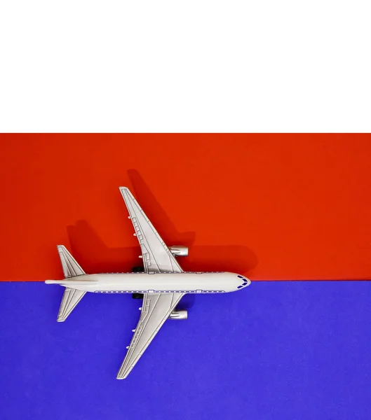 Metal Toy Airplane Red Blue Paper Background Travel Transportation Idea — Stock Photo, Image