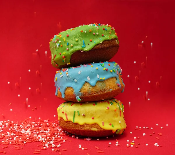 Side View Three Colorful Donuts Isolated Red Background Food Backdrop — Stock Photo, Image