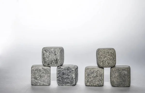 stone cubes  paper background. empty copy space for inscription.