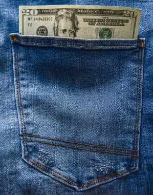 twenty  dollars in your pocket of blue jeans. 20 banknote bill.