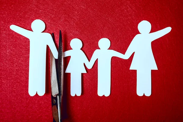 Scissors Dividing Whole Family Divorce Idea Wooden Figures Red Background — Stock Photo, Image