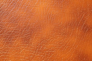 Yeni deri arka planda kahverengi tonu. Sorunsuz kare doku