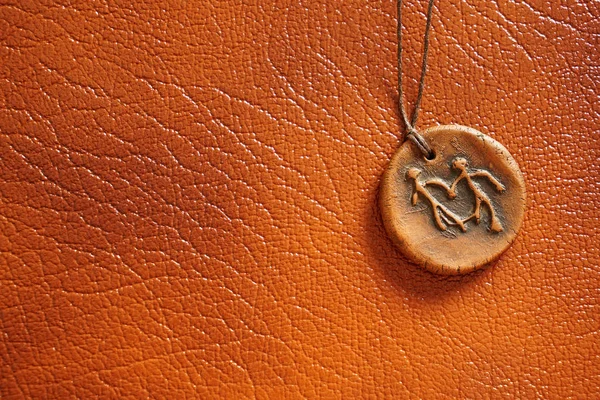 Stone Medallion String Brown Leather Background Pendant Couple Holding Hands — Stock Photo, Image