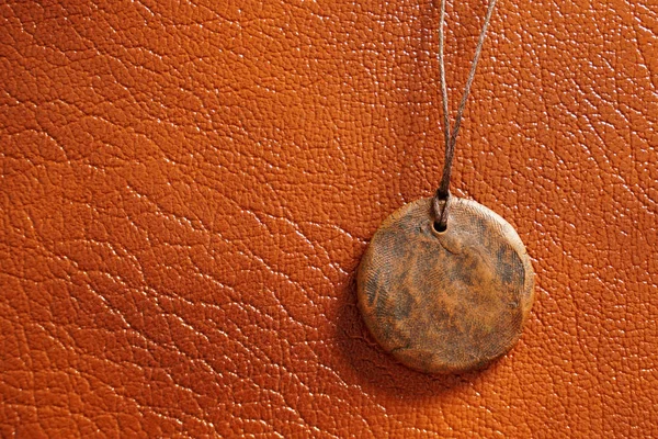 Stone Medallion String Brown Leather Background — Stock Photo, Image